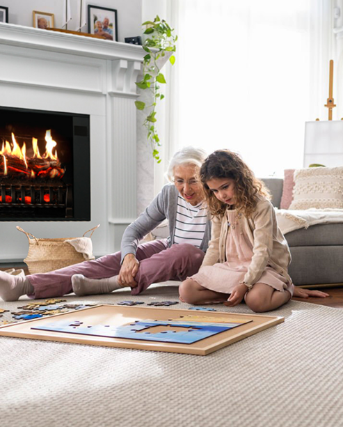 Grandmother and grandchildren on the sofa, Trinity fireplace glowing